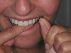 Floss up between your side teeth